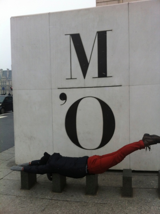 Austin trying to plank with Musee d'Orsay sign 